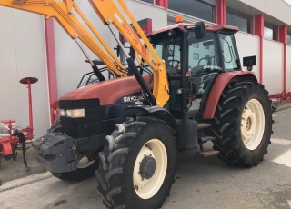 New Holland M115 DT con pala tenias y cazo de aridos, doble traccion, cambio manual con inversor electrohidraulico, 5 distribuidores traseros.